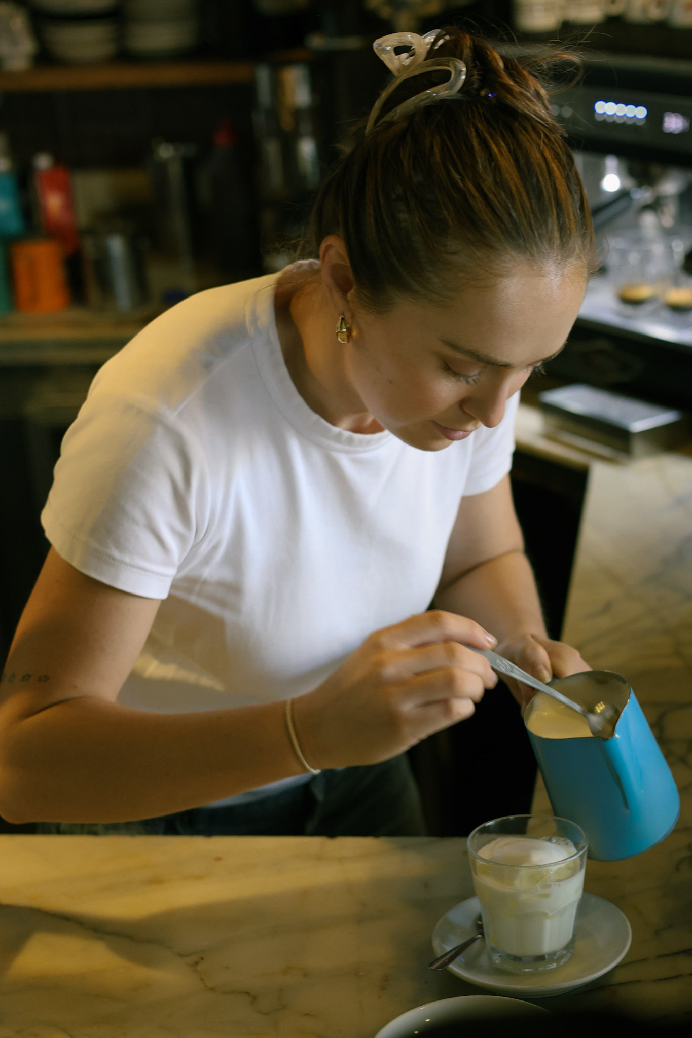 Barista pouring coffee
